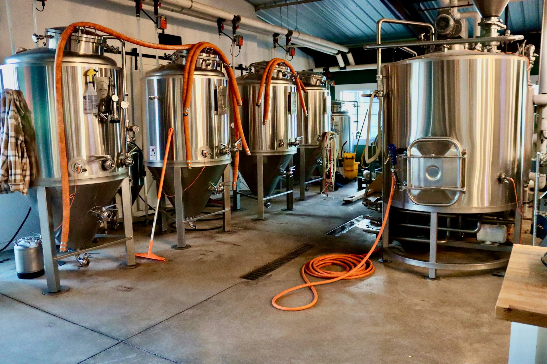 A room filled with lots of stainless steel tanks